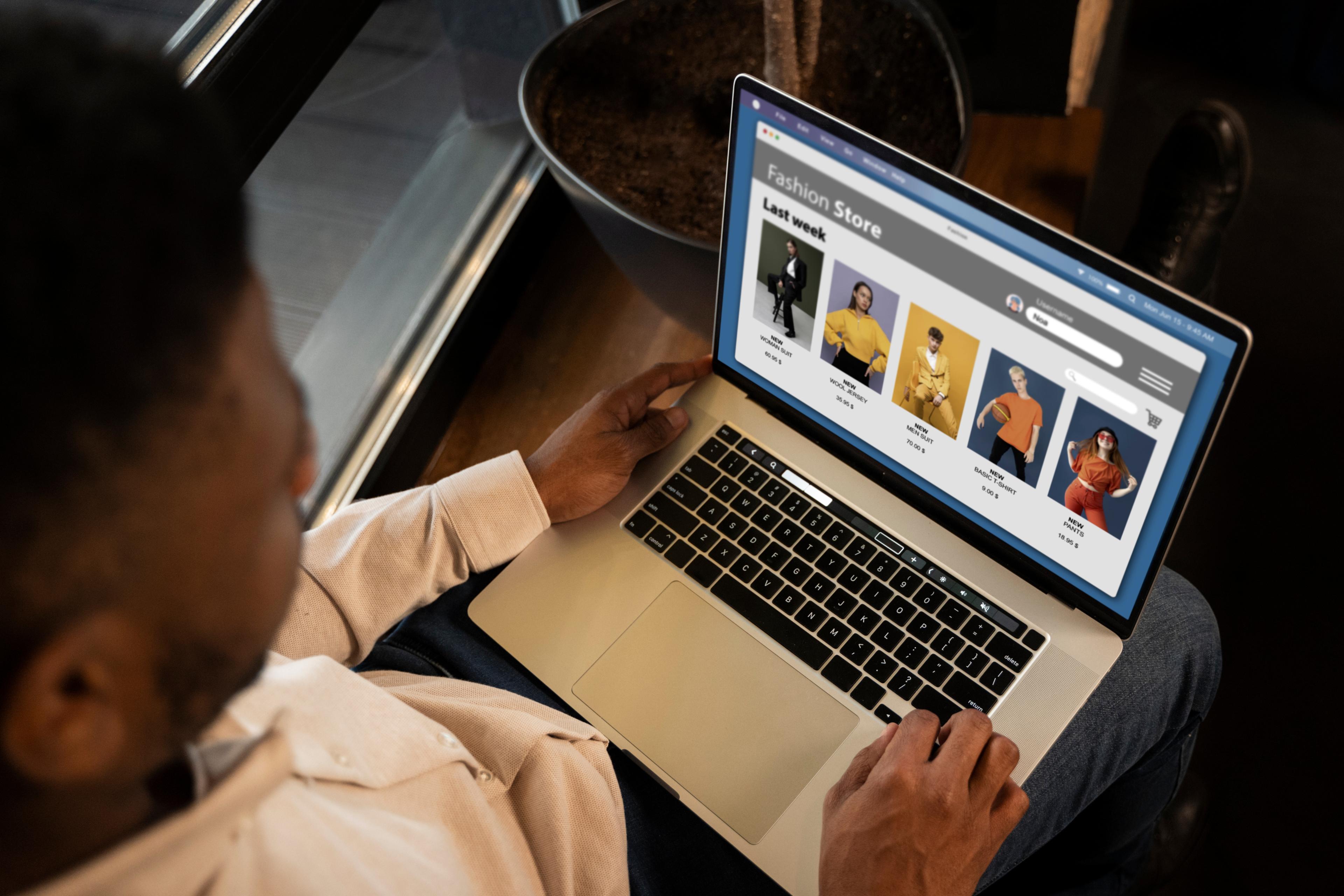 A man sitting before a laptop